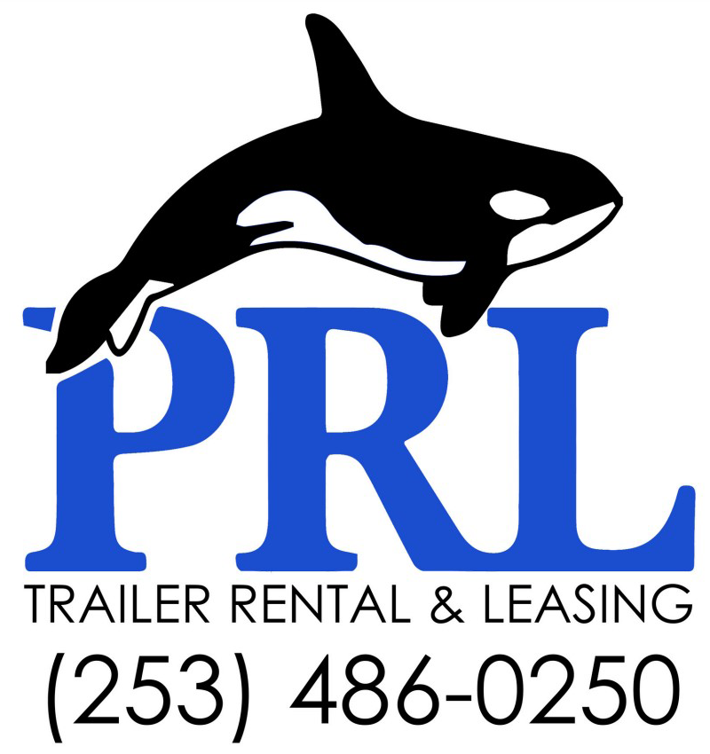 A semi truck pulling a PRL Trailer Rental & Leasing semi trailer on a sunny rural road bordered …